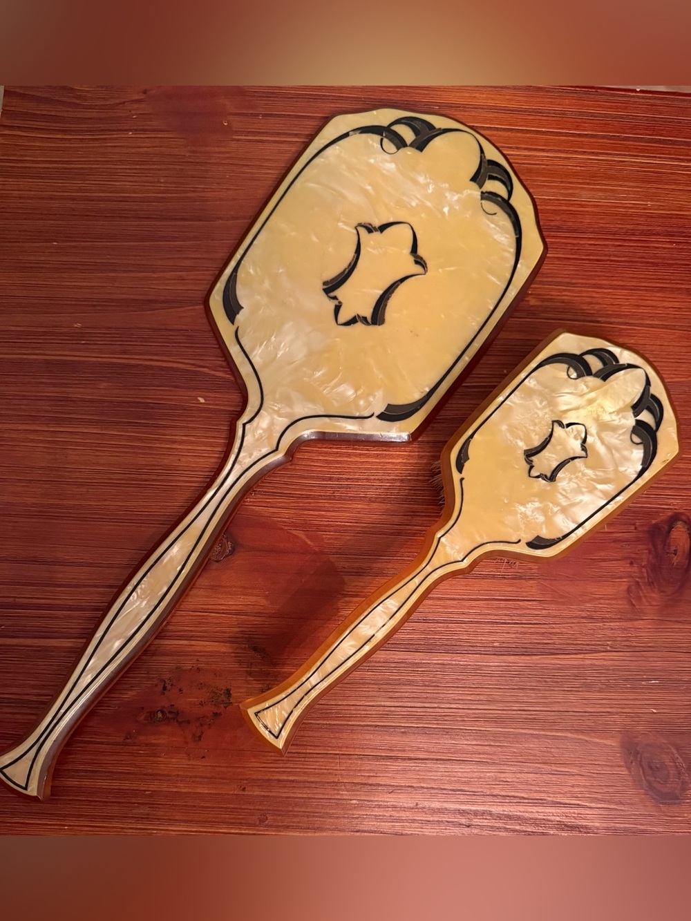 Handheld vanity mirror and brush